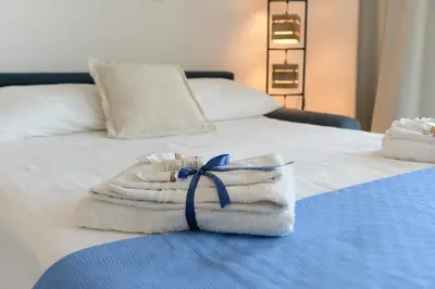 Letto o letti in una camera di Marzamemi casa di charme con vista mare e piscina