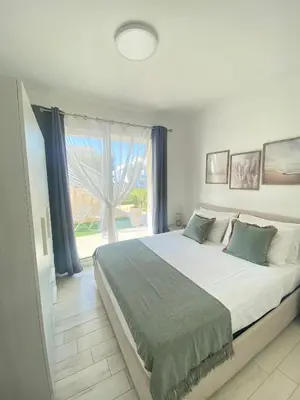 Letto o letti in una camera di Acquamarina