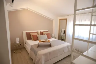 Letto o letti in una camera di Sweet Orange