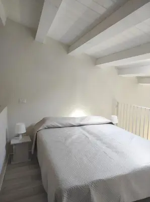 Letto o letti in una camera di Casa Rizzo, 2