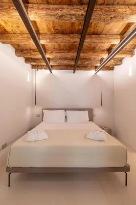 Letto o letti in una camera di Re Carlo - Ortigia Luxury Suite