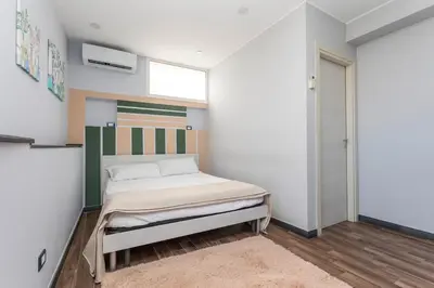 Letto o letti in una camera di Garibaldi Rooms
