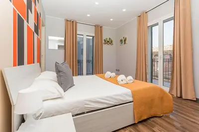 Letto o letti in una camera di Garibaldi Rooms