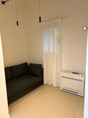 Area soggiorno di Alma Suites