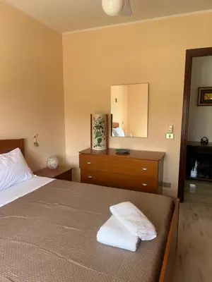 Letto o letti in una camera di Casa Artemisia