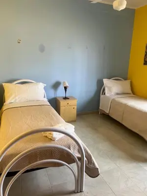 Letto o letti in una camera di Casa Artemisia