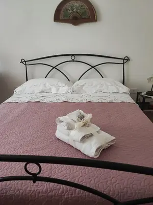 Letto o letti in una camera di Domus Elia