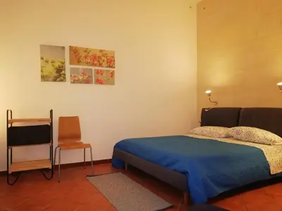 Letto o letti in una camera di Casa Angelica
