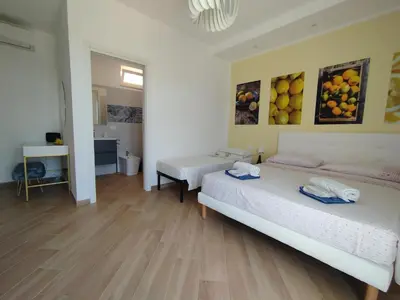 Letto o letti in una camera di I sapori della Sicilia