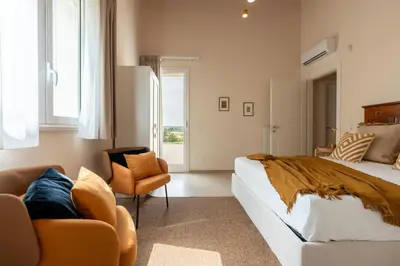 Letto o letti in una camera di Villa Calicanto con jacuzzi riscaldata