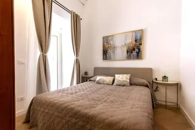 Letto o letti in una camera di Casa Vico Ferruccio 24