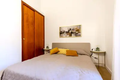 Letto o letti in una camera di Casa Vico Ferruccio 24