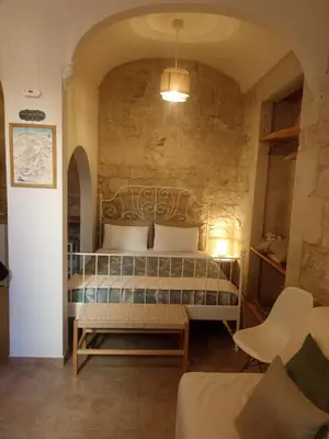 Letto o letti in una camera di Tirella Home