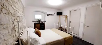 Letto o letti in una camera di Tirella Home