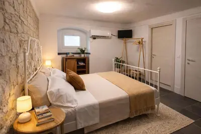 Letto o letti in una camera di Tirella Home