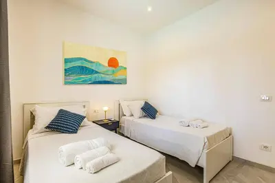 Letto o letti in una camera di Villa Kennedy by Villa Plus