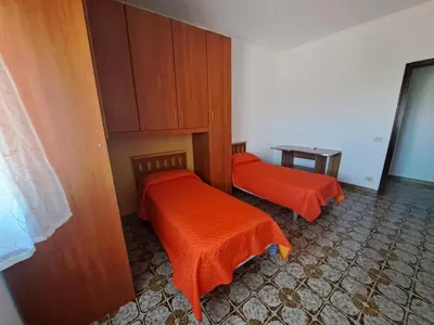 Letto o letti in una camera di A casa di Roy