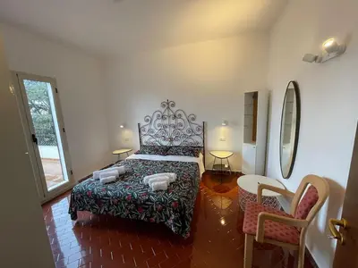 Letto o letti in una camera di Villa fontane bianche