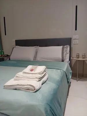 Letto o letti in una camera di Giù per la Costa - Siracusa