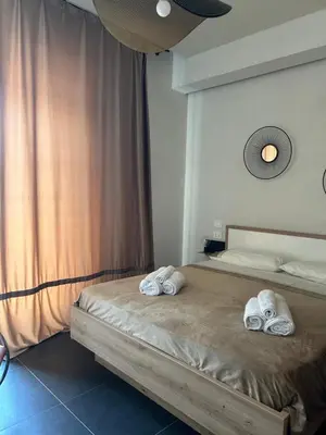 Letto o letti in una camera di Giù per la Costa - Siracusa
