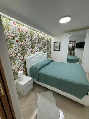 Letto o letti in una camera di Candy House