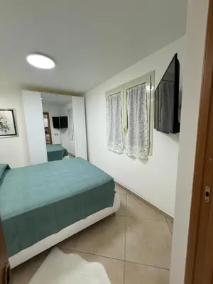 Letto o letti in una camera di Candy House