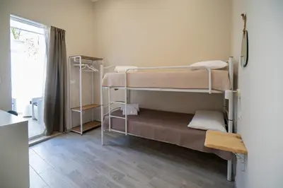 Letto o letti in una camera di L'angolo floreale House- Catania