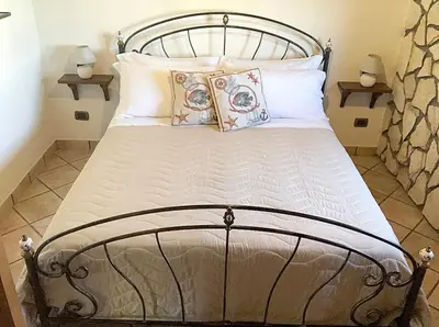 Letto o letti in una camera di Villa Donna Zina