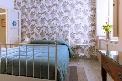 Letto o letti in una camera di B&B Cumpari Turiddu