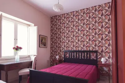 Letto o letti in una camera di B&B Cumpari Turiddu