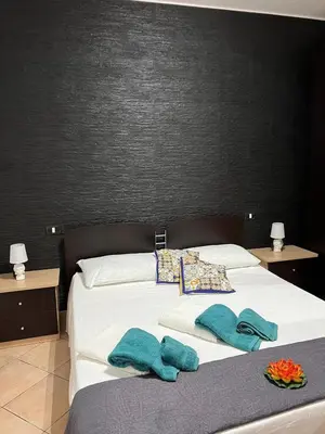 Letto o letti in una camera di Profumo di marzamemi