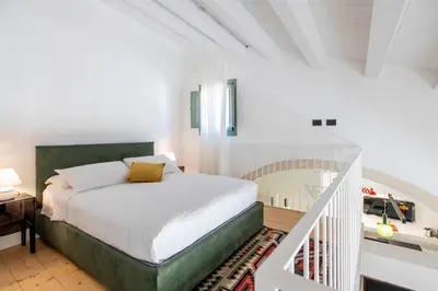 Letto o letti in una camera di Ronco Concordia 10