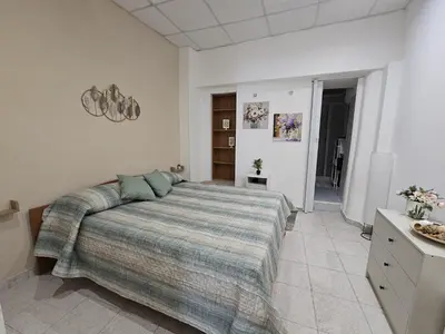 Letto o letti in una camera di Viculu Beddu - Appartamento centro storico Catania