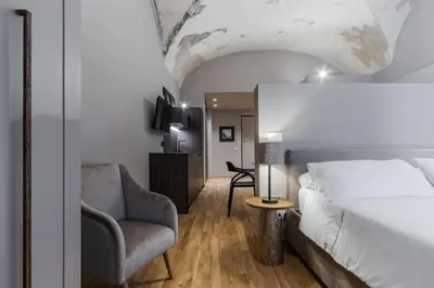 Letto o letti in una camera di Ferrini Home - Le concerie