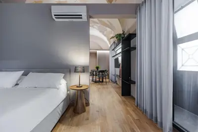 Letto o letti in una camera di Ferrini Home - Le concerie