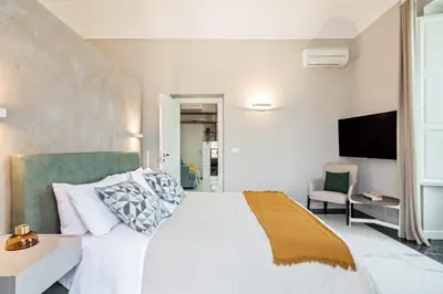 Letto o letti in una camera di Riva Design Apartments by Wonderful Italy