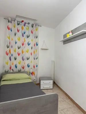 Letto o letti in una camera di Casa Vacanze Chi mi cunti