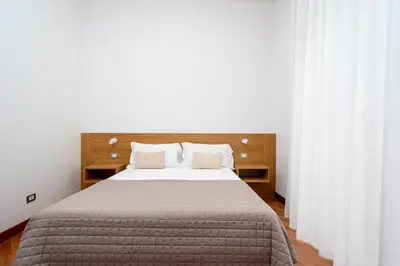 Letto o letti in una camera di Casa degli Artisti, a spacious apartment in the center
