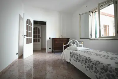 Letto o letti in una camera di Dimora sicula a due passi dal mare con patio verde