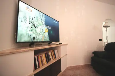 TV o dispositivi per l'intrattenimento presso Dimora sicula a due passi dal mare con patio verde