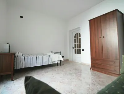 Letto o letti in una camera di Dimora sicula a due passi dal mare con patio verde