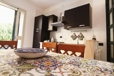 TV o dispositivi per l'intrattenimento presso Dimora sicula a due passi dal mare con patio verde