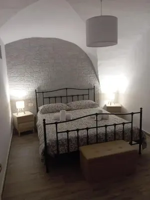 Letto o letti in una camera di RitAria Centro storico di Catania