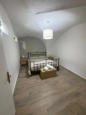 Letto o letti in una camera di RitAria Centro storico di Catania