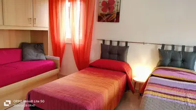 Letto o letti in una camera di casa Rubino
