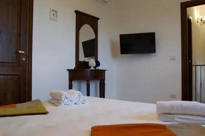Letto o letti in una camera di Villa Belvedere