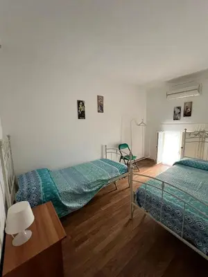 Letto o letti in una camera di Siracusa Tribe House