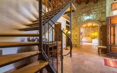 Letto o letti in una camera di Villa Chiaramonte