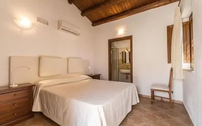Letto o letti in una camera di Villa Chiaramonte