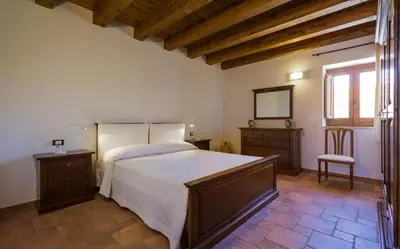 Letto o letti in una camera di Villa Chiaramonte